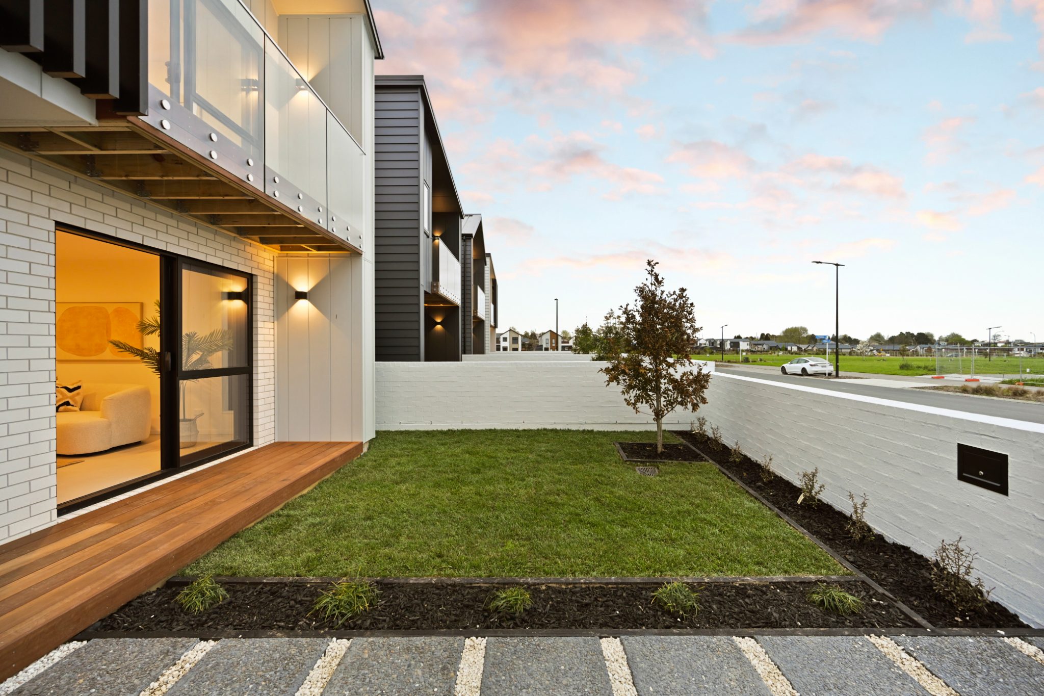 Completed home with balcony, timber deck and landscaped front garden