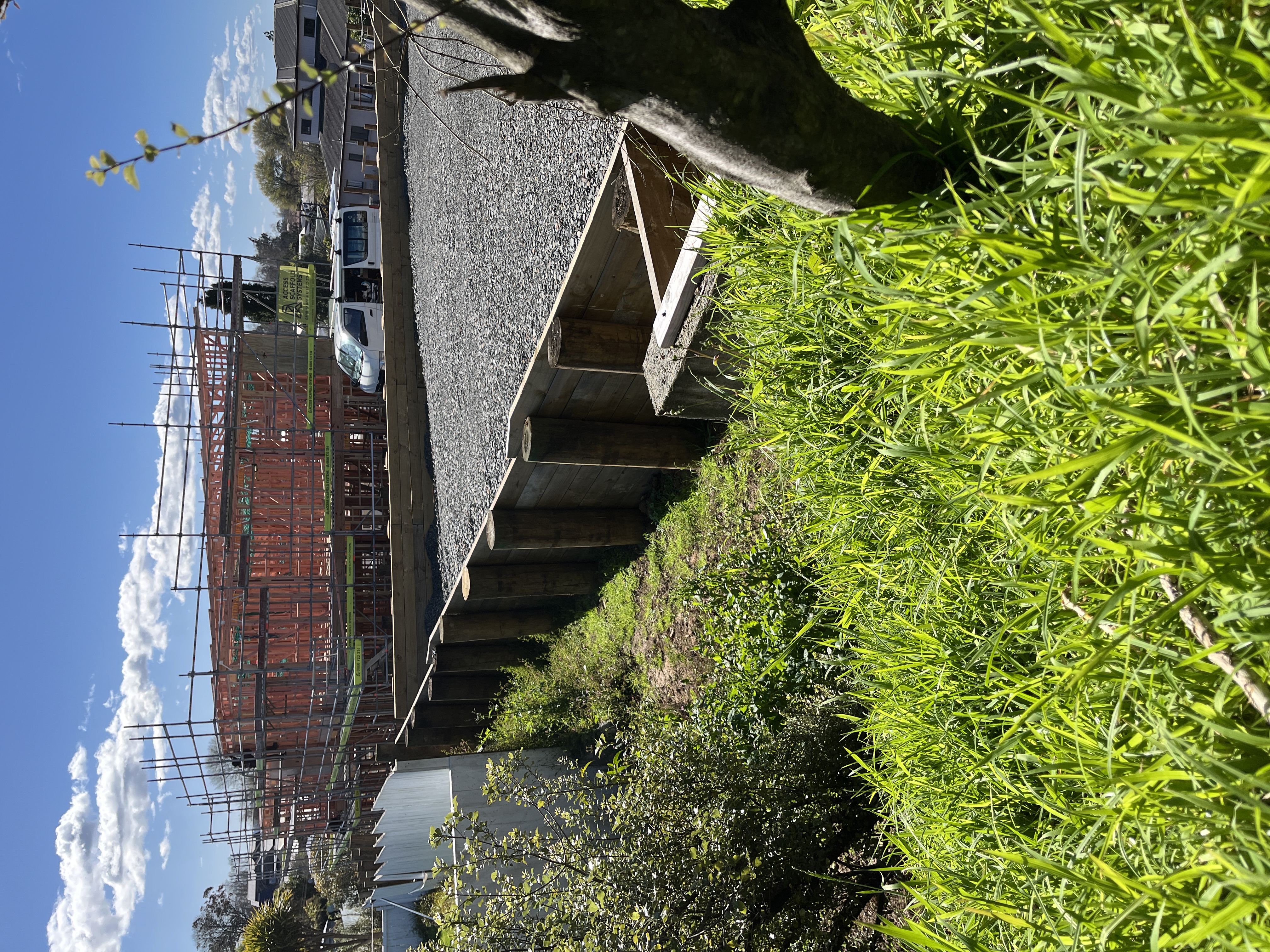 Retaining walls and building progress at Storey Ave