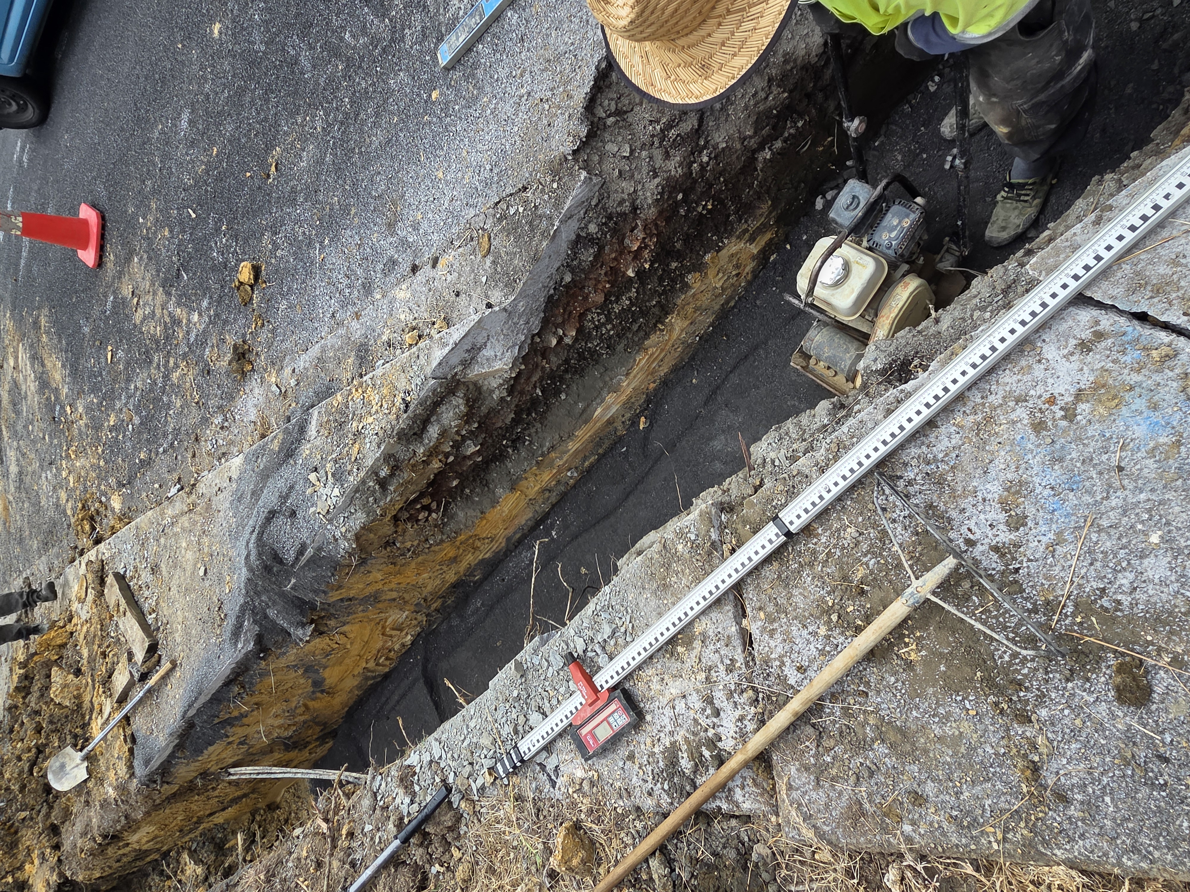 Excavated drainage trench alongside the road