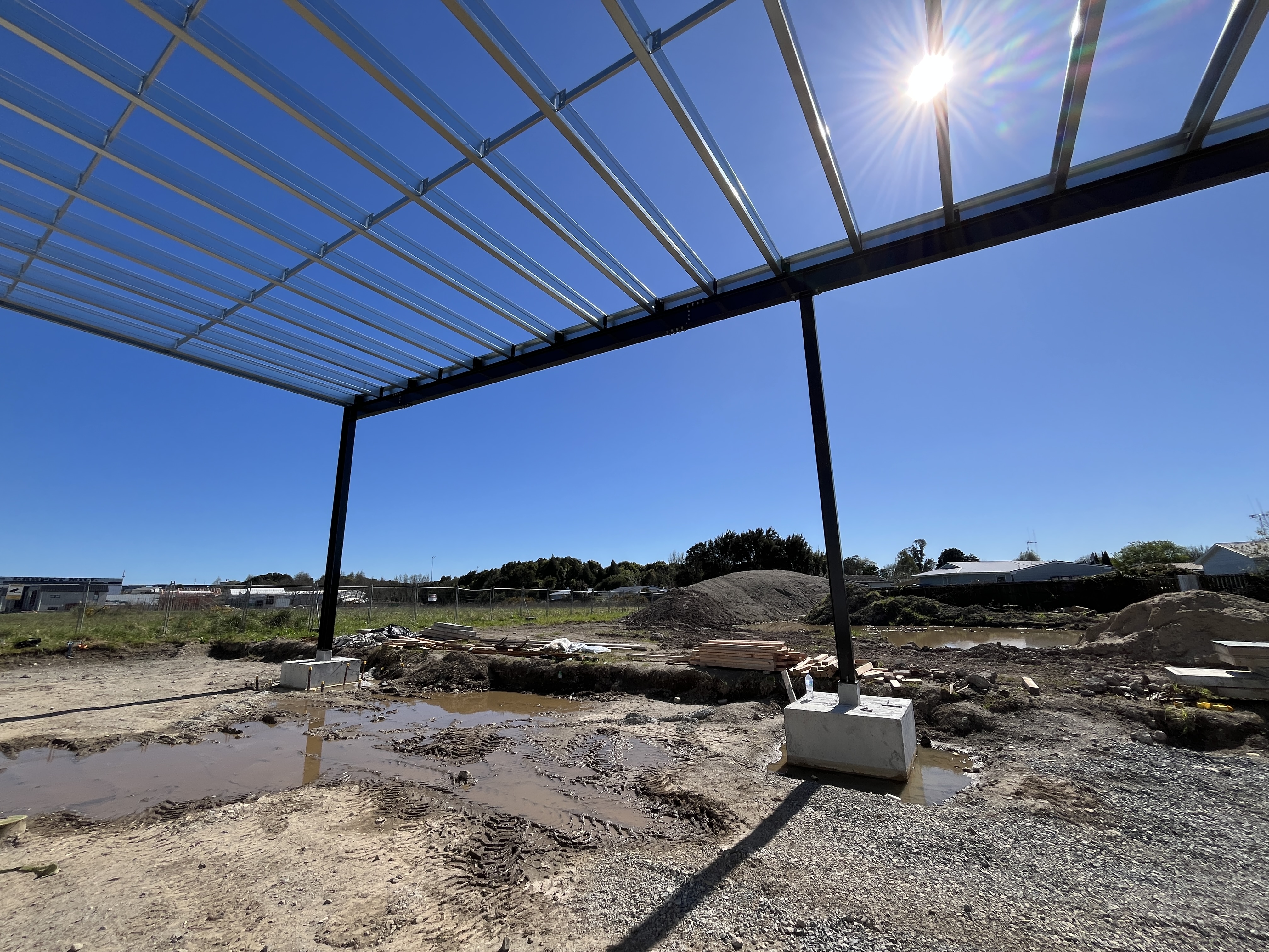 Structural steel columns and roof framing at Welmart Supermarket